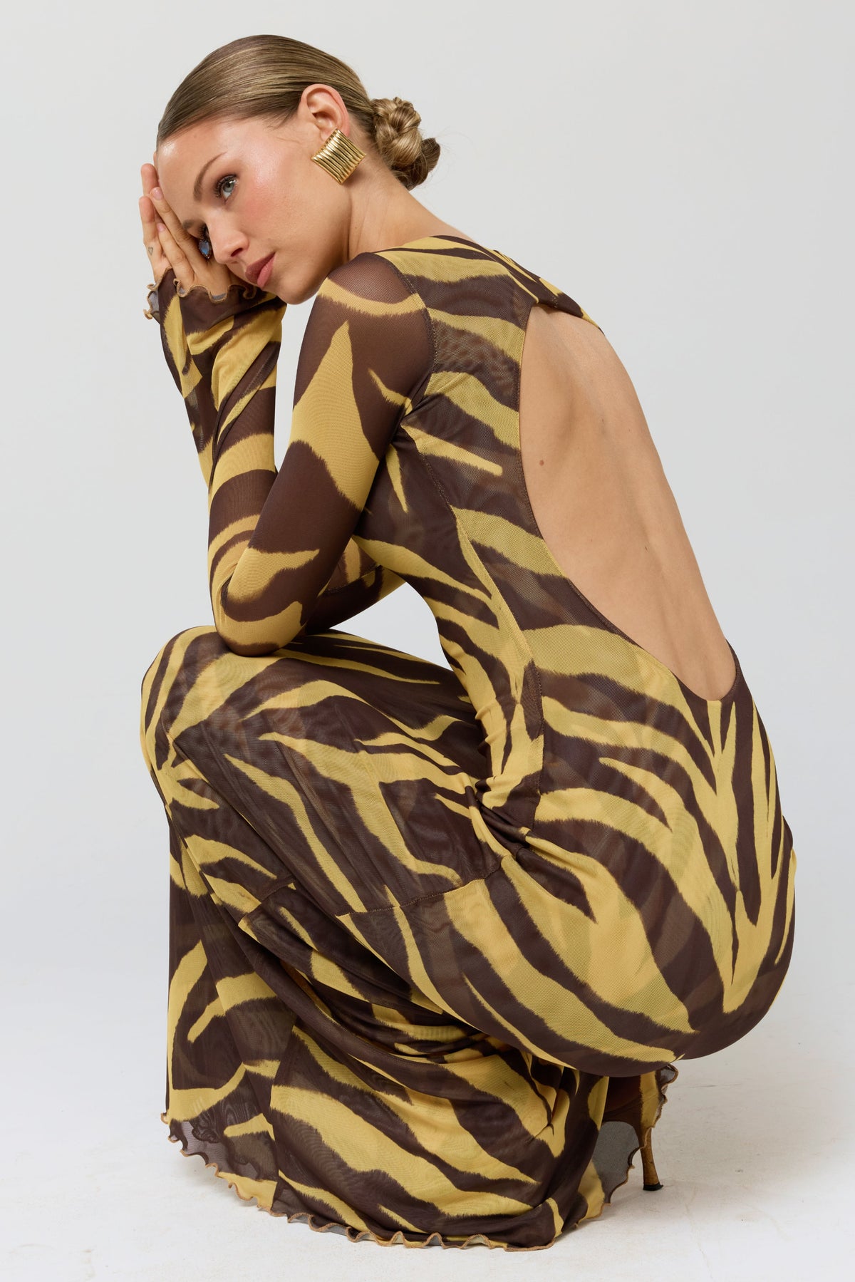 This is an image of Sylvia Dress in Raja - RESA featuring a model wearing the dress
