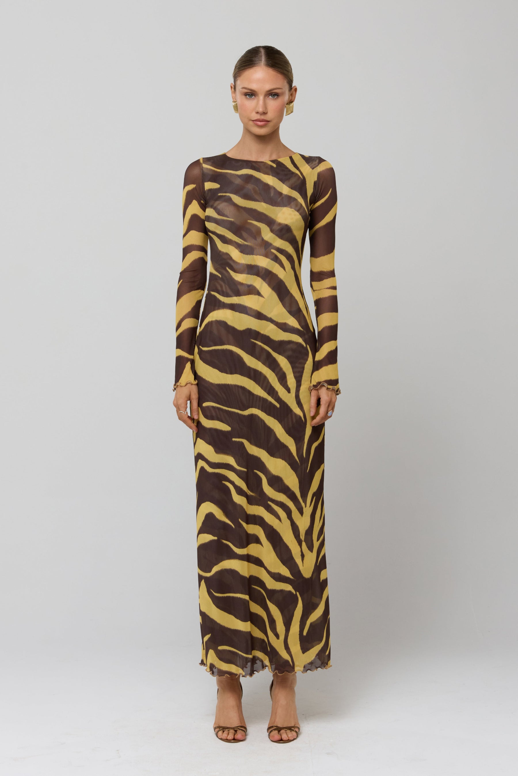 This is an image of Sylvia Dress in Raja - RESA featuring a model wearing the dress
