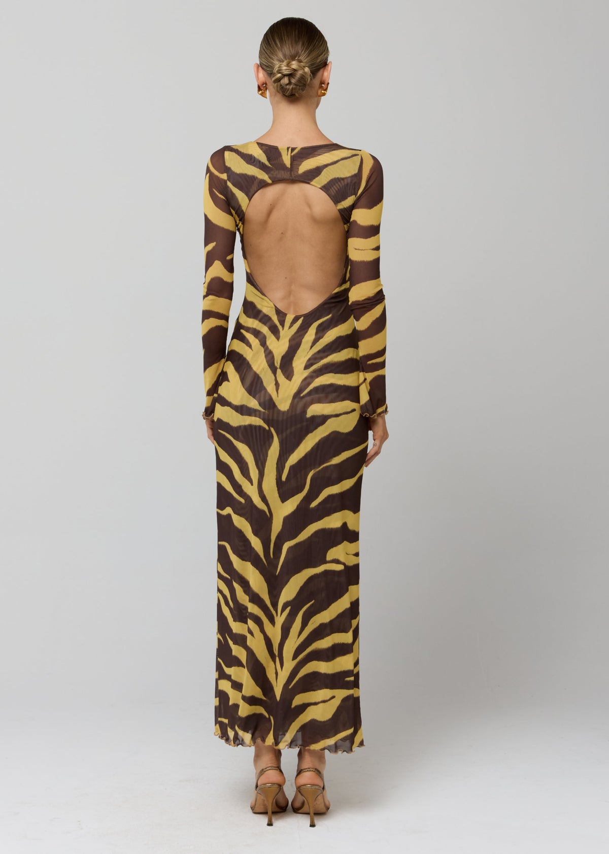 This is an image of Sylvia Dress in Raja - RESA featuring a model wearing the dress