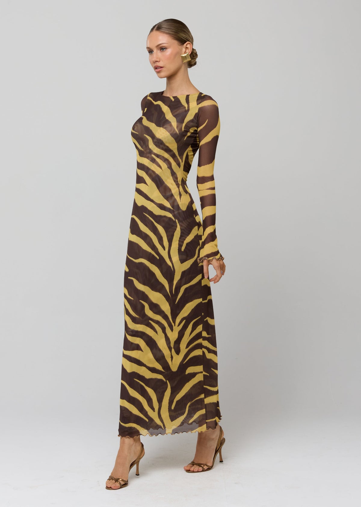 This is an image of Sylvia Dress in Raja - RESA featuring a model wearing the dress