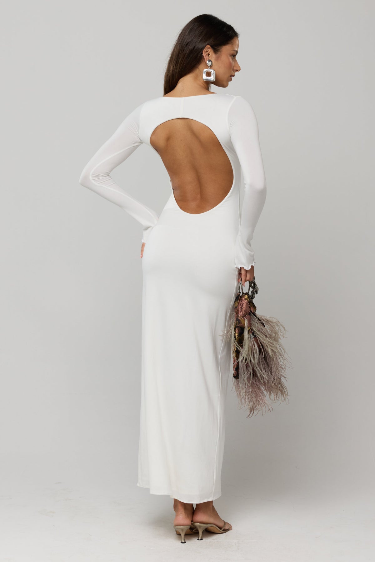 This is an image of Sylvia Dress in White Knit - RESA featuring a model wearing the dress