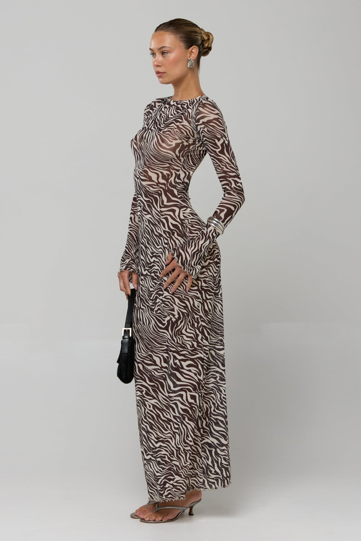 This is an image of Sylvia Single Lined in Selva - RESA featuring a model wearing the dress