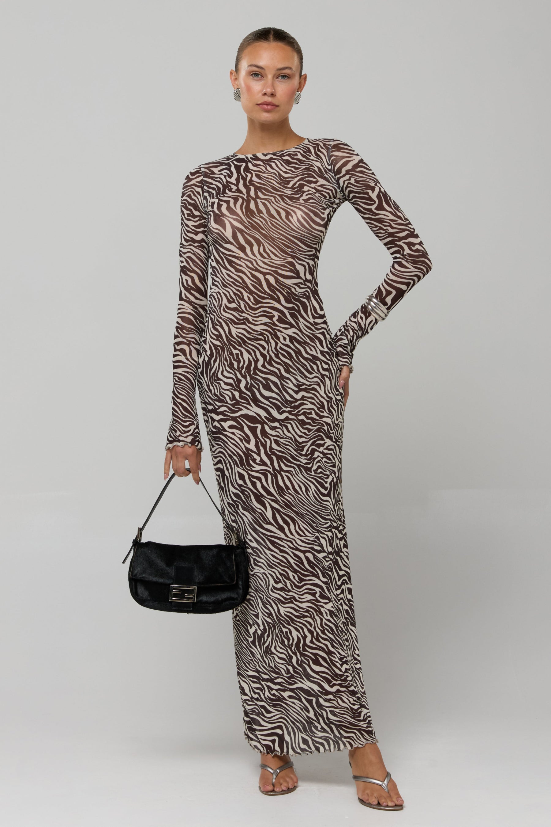 This is an image of Sylvia Single Lined in Selva - RESA featuring a model wearing the dress