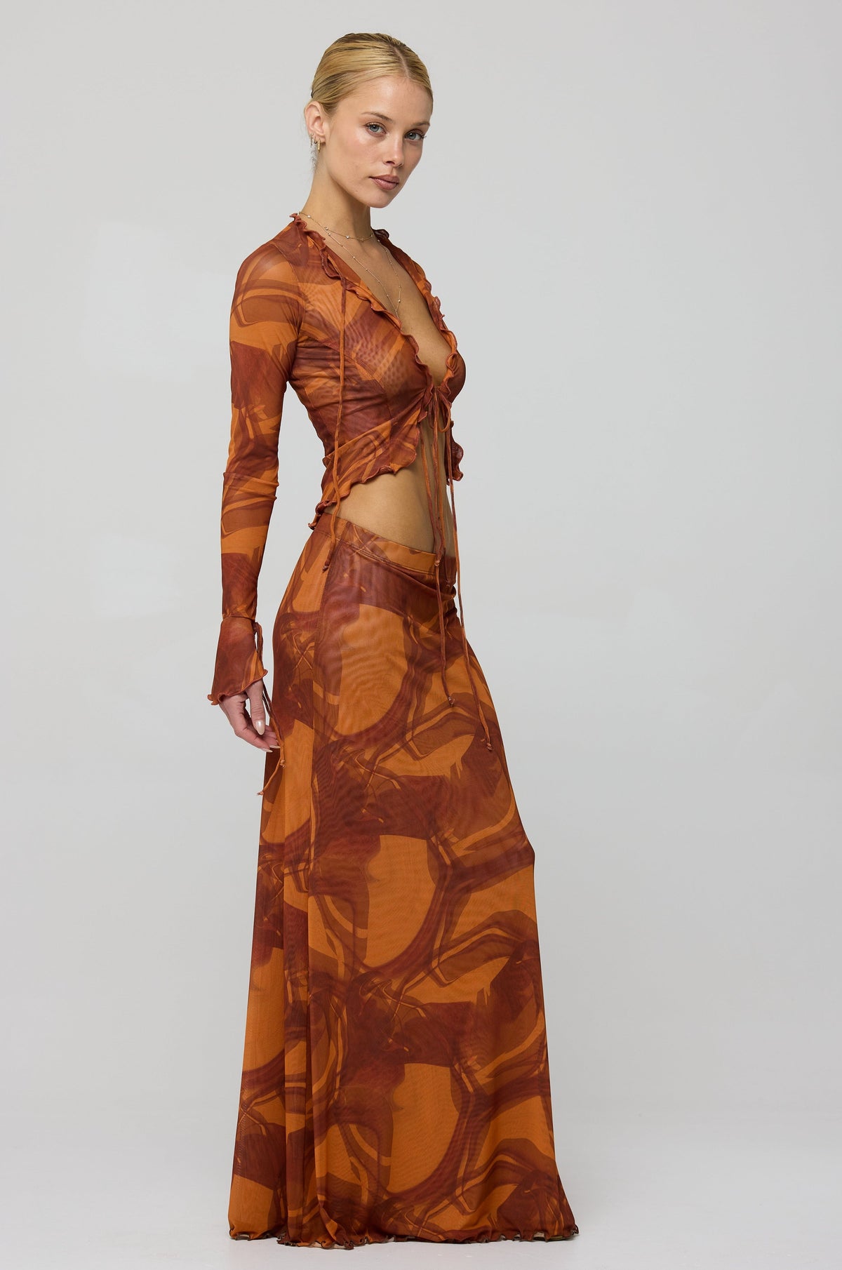 This is an image of Tezza Top in Flame - RESA featuring a model wearing the dress