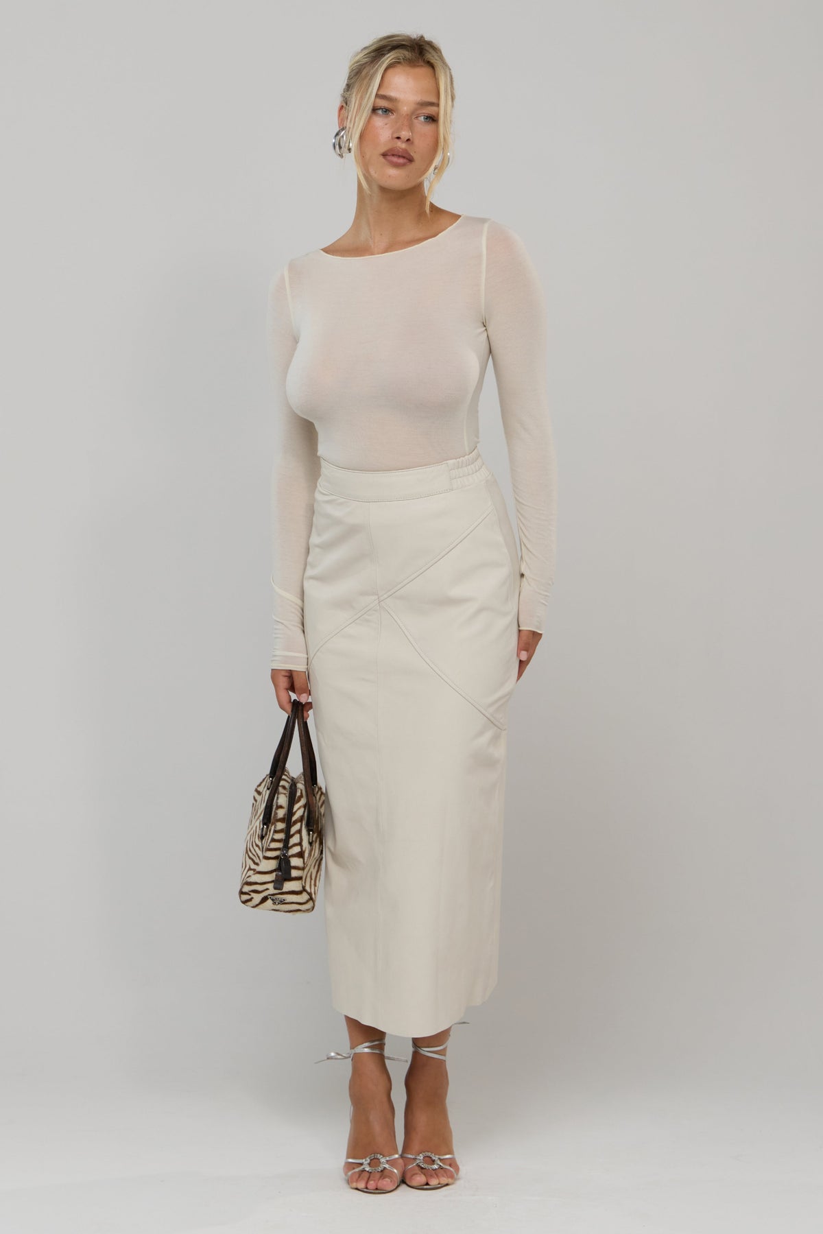 This is an image of Tissue Knit in Cream - RESA featuring a model wearing the dress