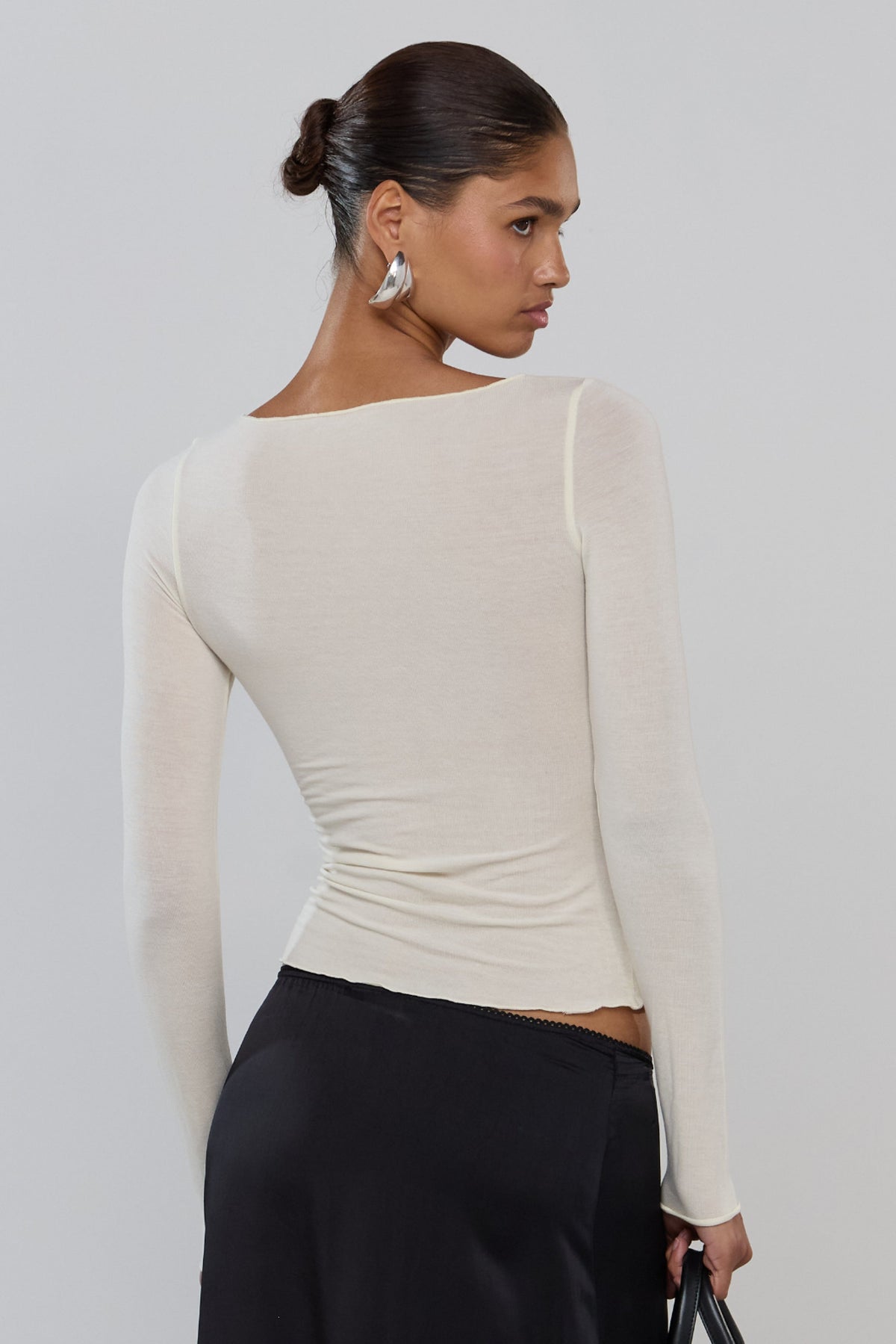 This is an image of Tissue Knit in Cream - RESA featuring a model wearing the dress
