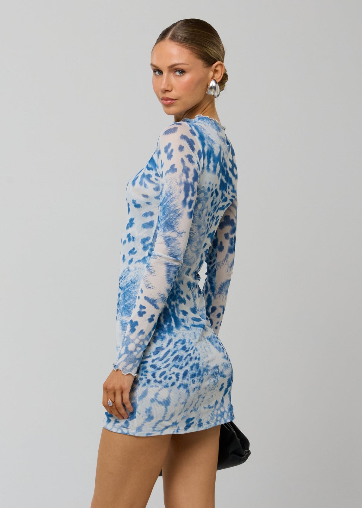 This is an image of Tyler Mini in Neve - RESA featuring a model wearing the dress