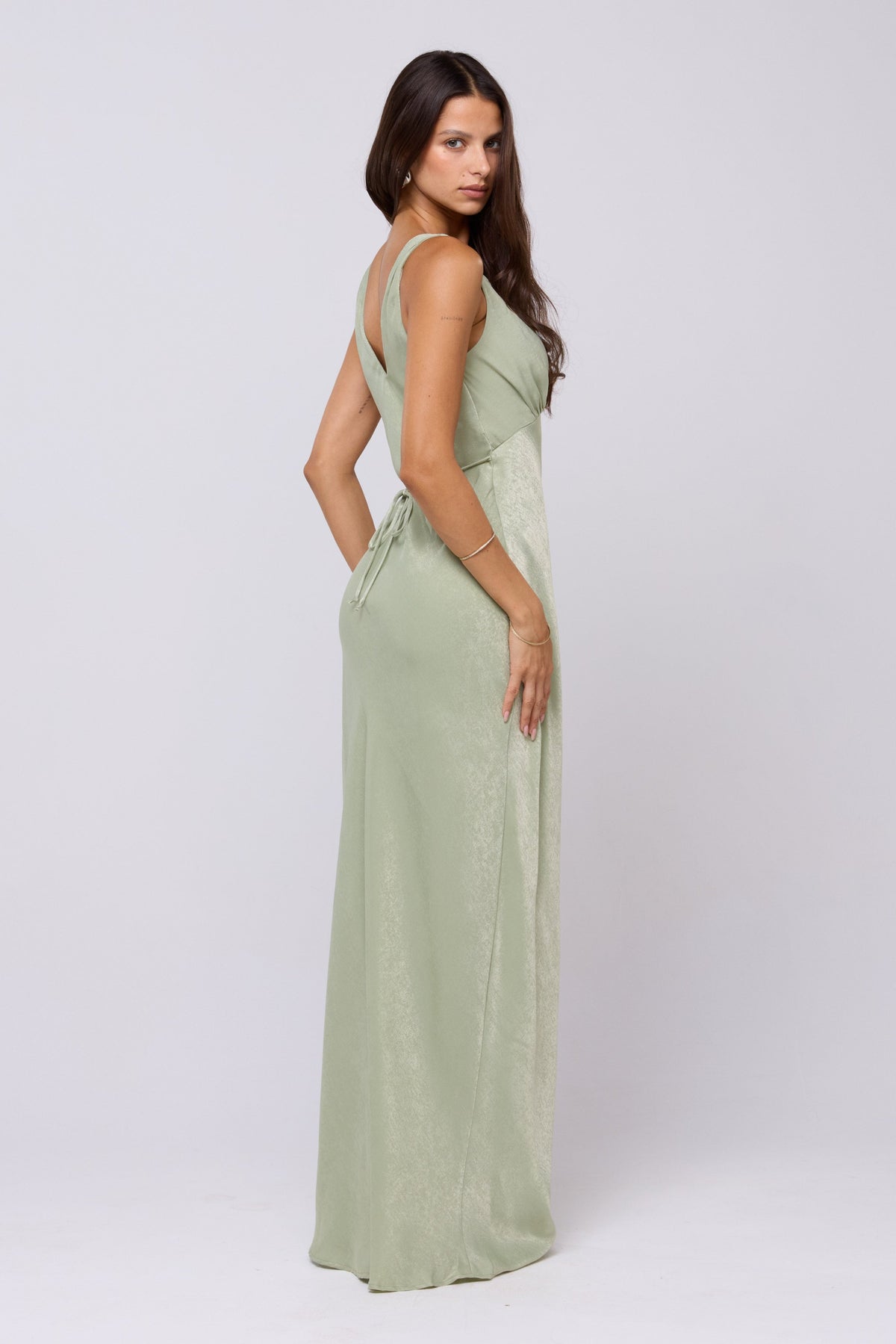 This is an image of Violet Maxi in Sage - RESA featuring a model wearing the dress