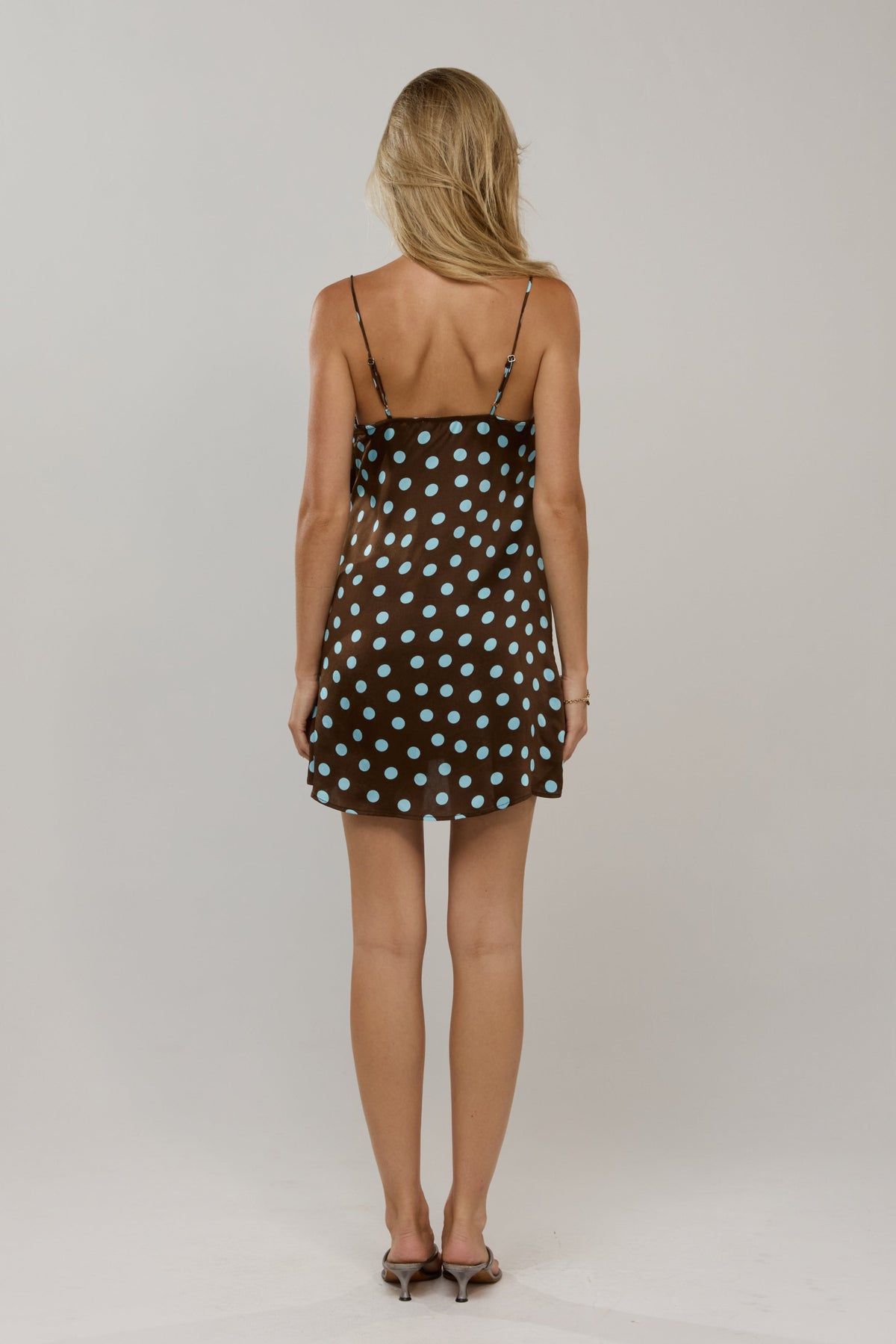 This is an image of Vivi in Costa - RESA featuring a model wearing the dress