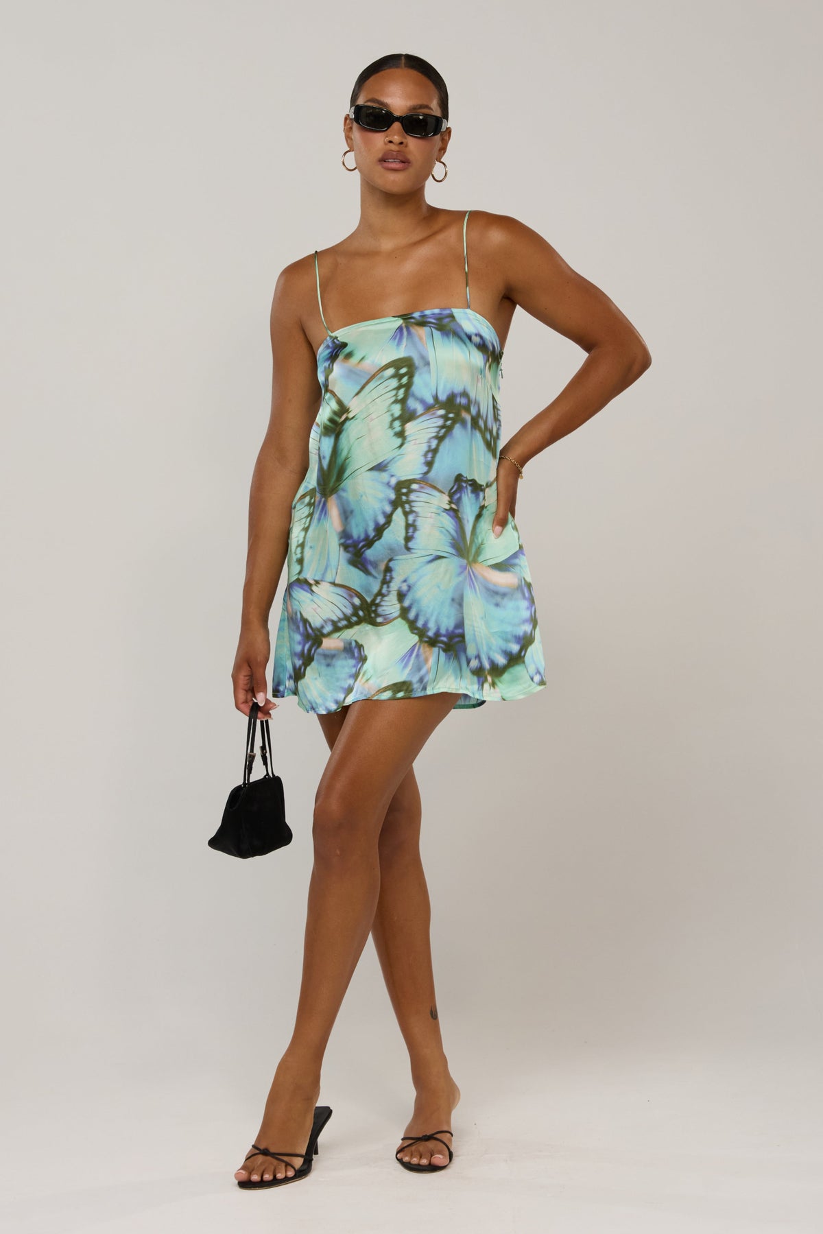 This is an image of Vivi in Mariposa - RESA featuring a model wearing the dress