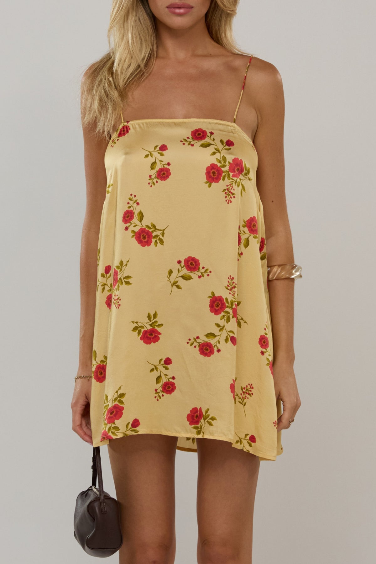 This is an image of Vivi in Saffron - RESA featuring a model wearing the dress