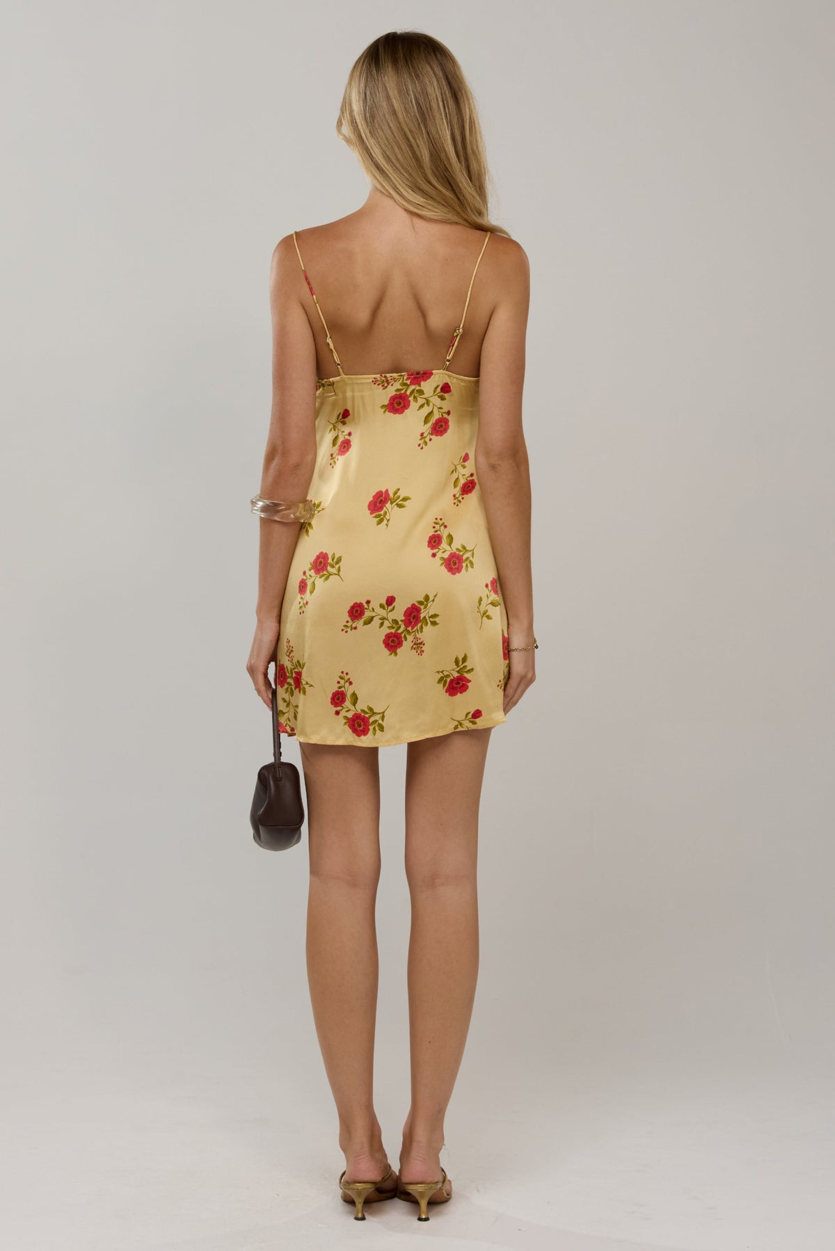 This is an image of Vivi in Saffron - RESA featuring a model wearing the dress
