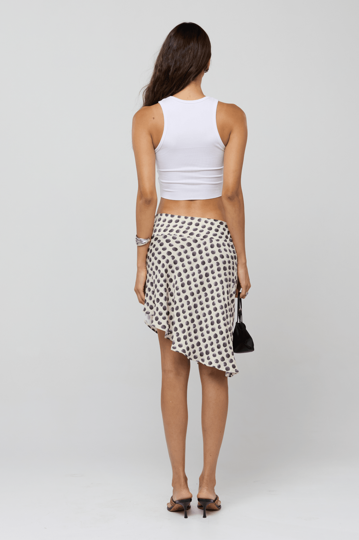 This is an image of Zahara Skirt in Eclipse - RESA featuring a model wearing the dress