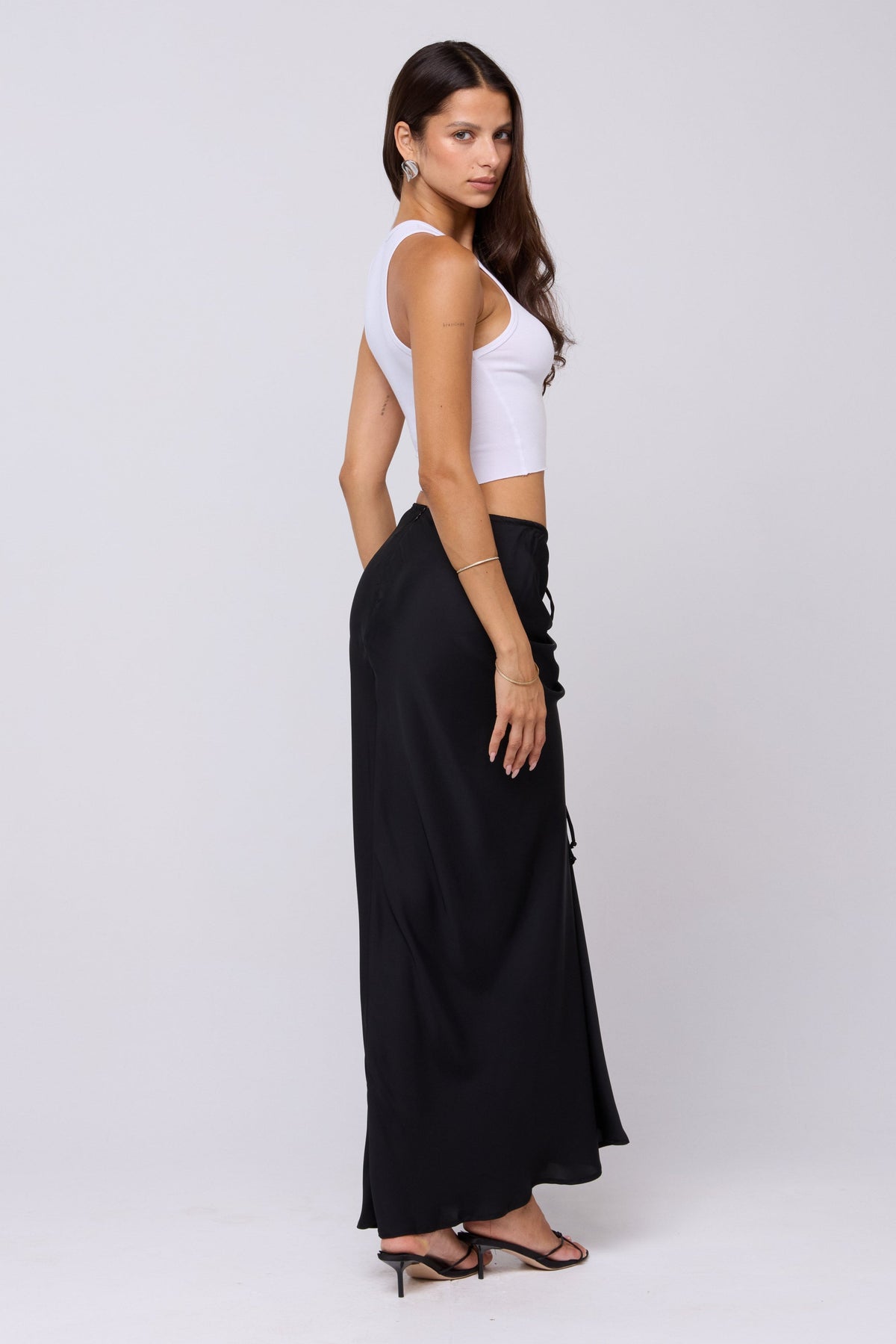 This is an image of Ziggy Skirt in Black - RESA featuring a model wearing the dress