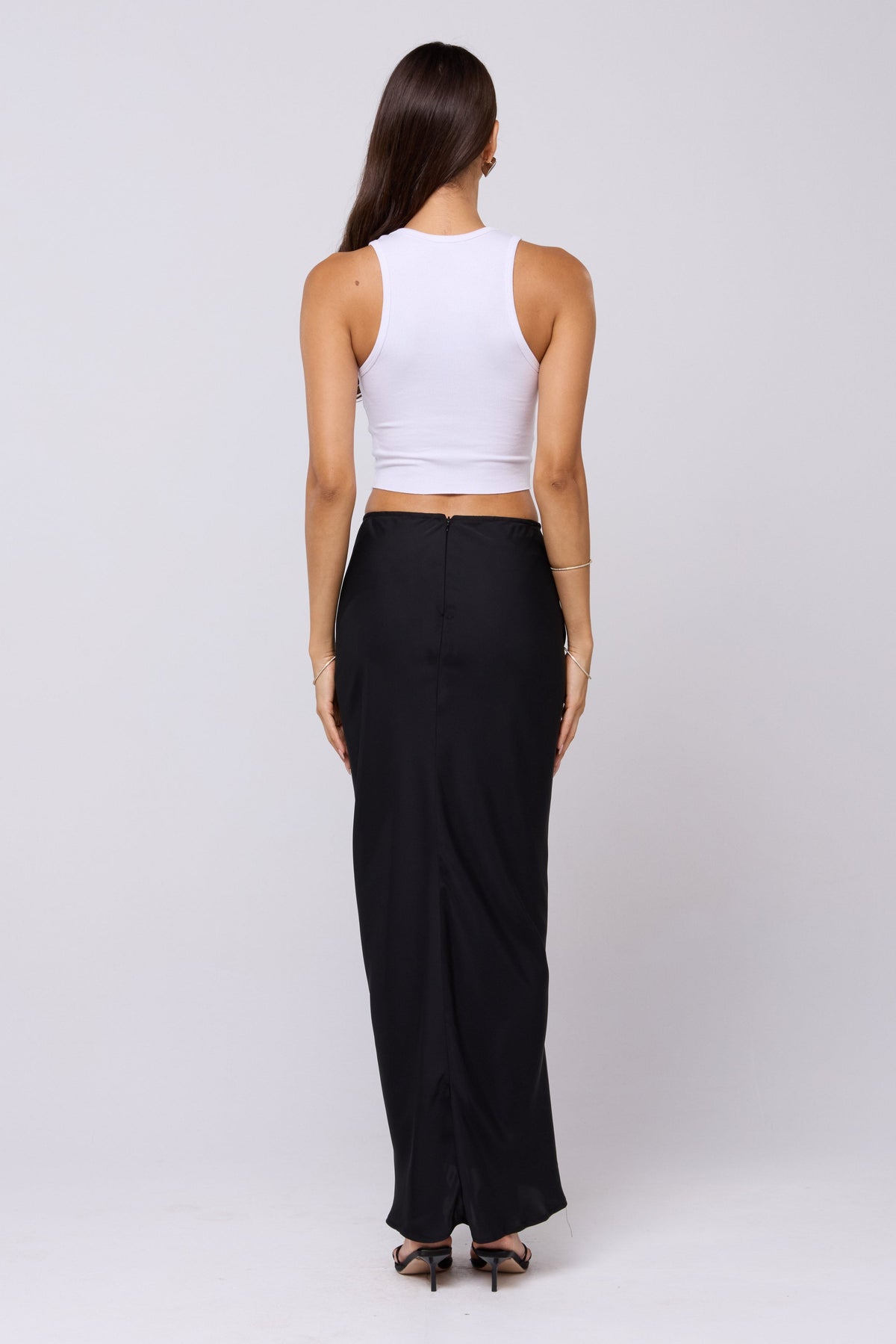 This is an image of Ziggy Skirt in Black - RESA featuring a model wearing the dress