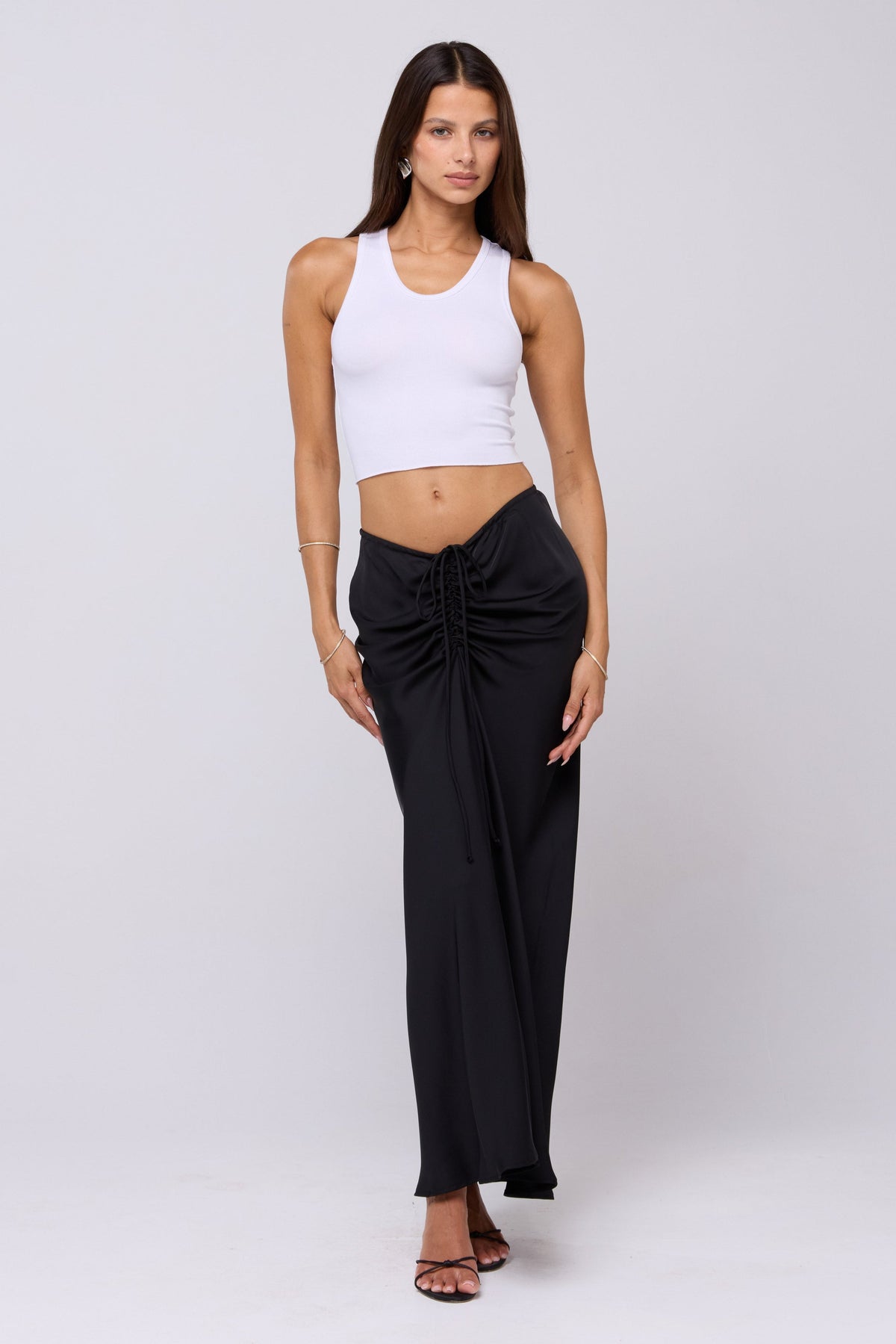This is an image of Ziggy Skirt in Black - RESA featuring a model wearing the dress