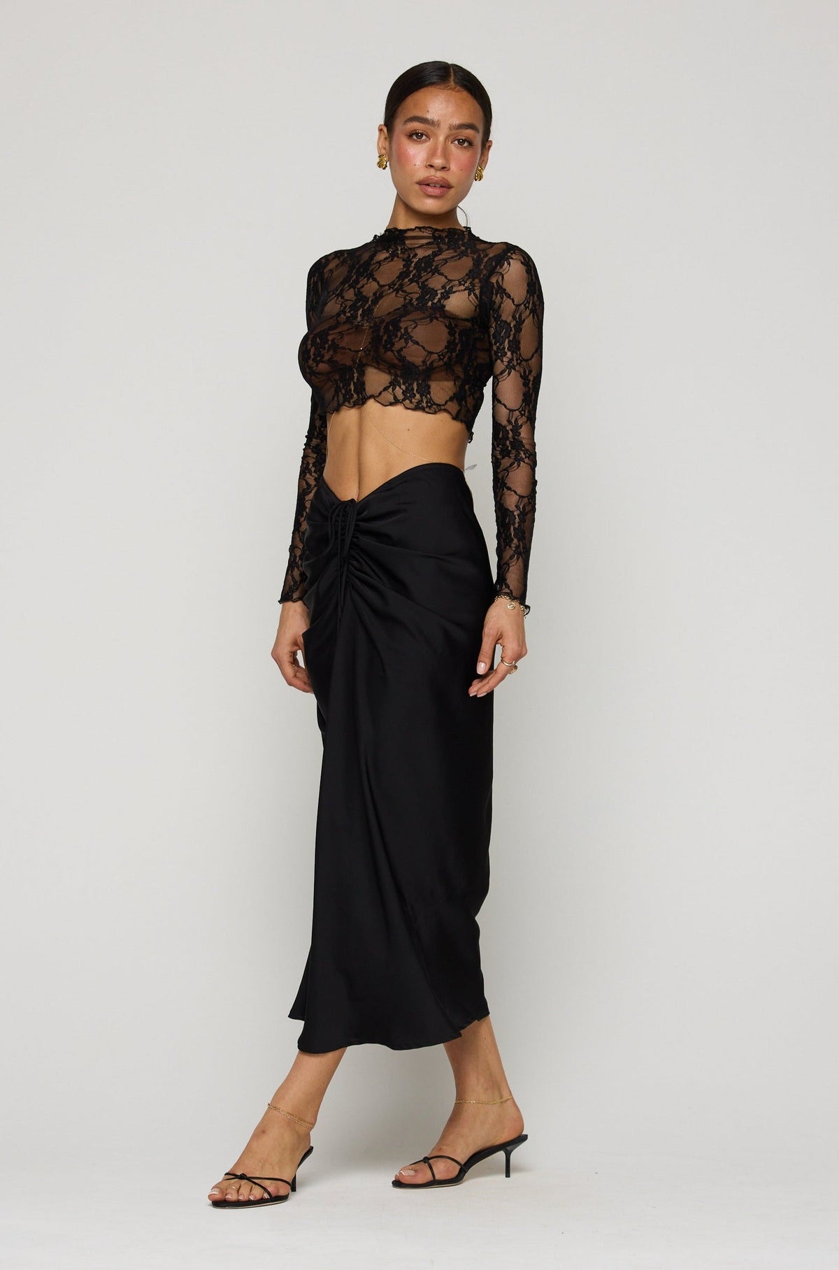 This is an image of Ziggy Skirt in Black - RESA featuring a model wearing the dress