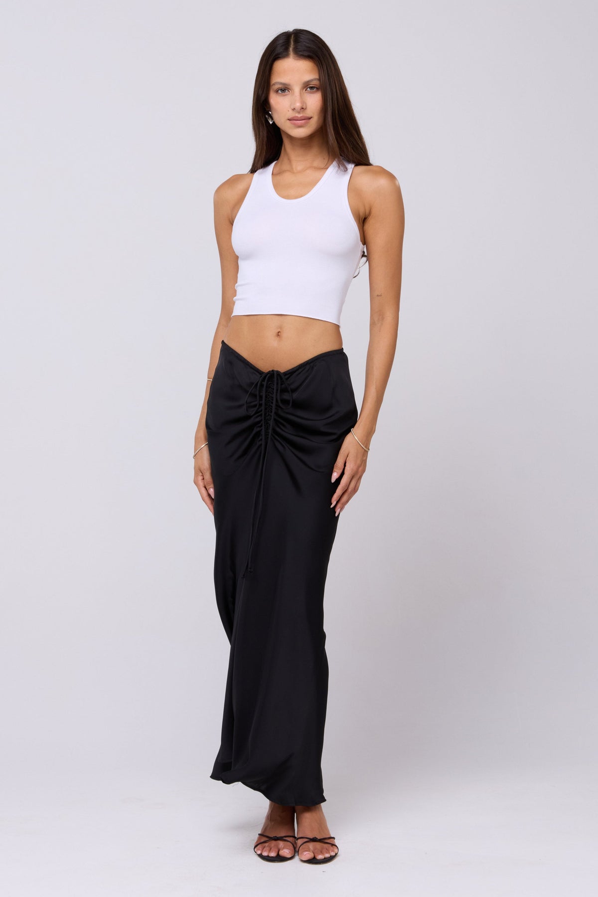 This is an image of Ziggy Skirt in Black - RESA featuring a model wearing the dress