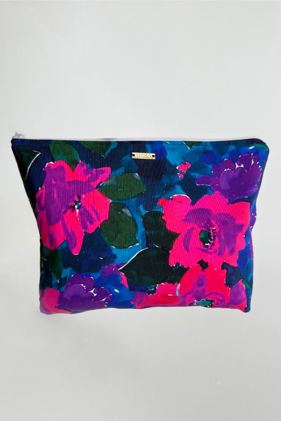 This is an image of Zipper Pouch in Lanai - RESA featuring a model wearing the dress