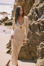 This is an image of Aisha Dress in Natural - RESA featuring a model wearing the dress