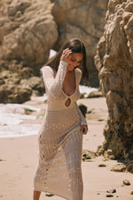 This is an image of Aisha Dress in Natural - RESA featuring a model wearing the dress