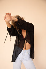 This is an image of Aliyah Blouse in Black - RESA featuring a model wearing the dress