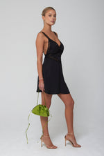 This is an image of Amelia Mini in Black - RESA featuring a model wearing the dress