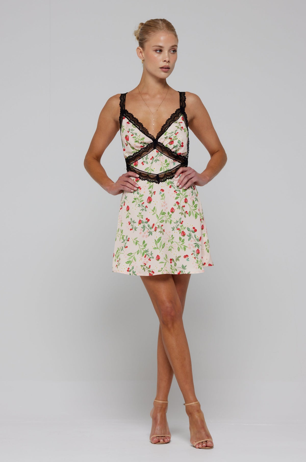 This is an image of Amelia Mini in Cherie - RESA featuring a model wearing the dress