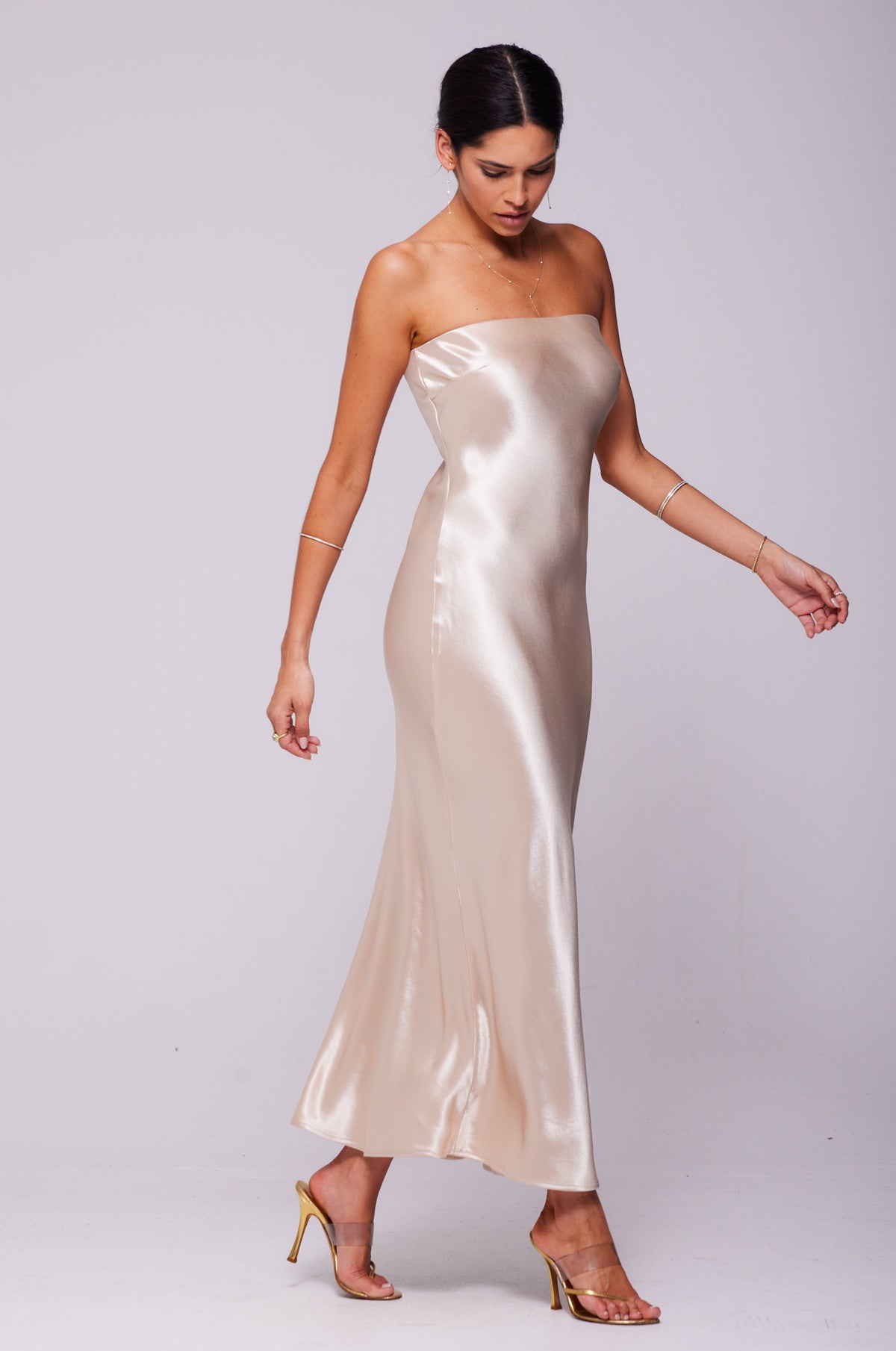 This is an image of Anna Slip in Champagne - RESA featuring a model wearing the dress