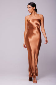 This is an image of Anna Slip in Copper - RESA featuring a model wearing the dress