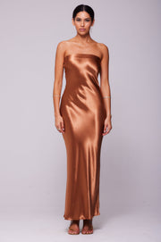 This is an image of Anna Slip in Copper - RESA featuring a model wearing the dress