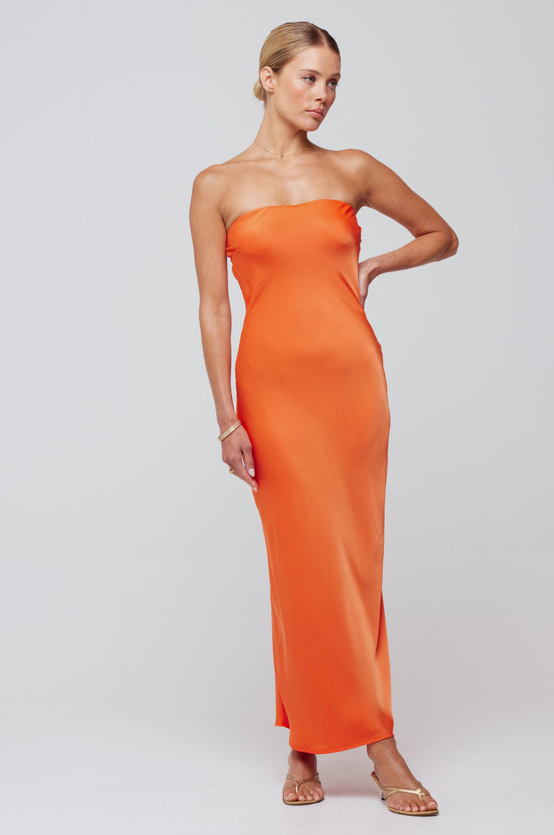 This is an image of Anna Slip in Papaya - RESA featuring a model wearing the dress