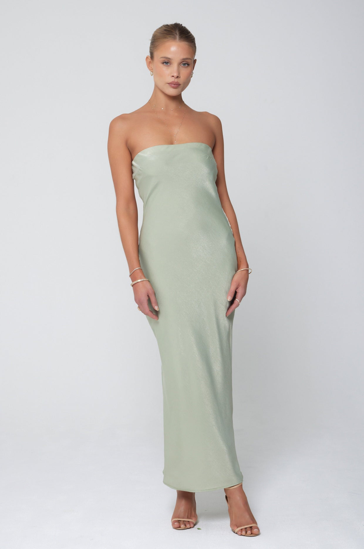 This is an image of Anna Slip in Sage - RESA featuring a model wearing the dress