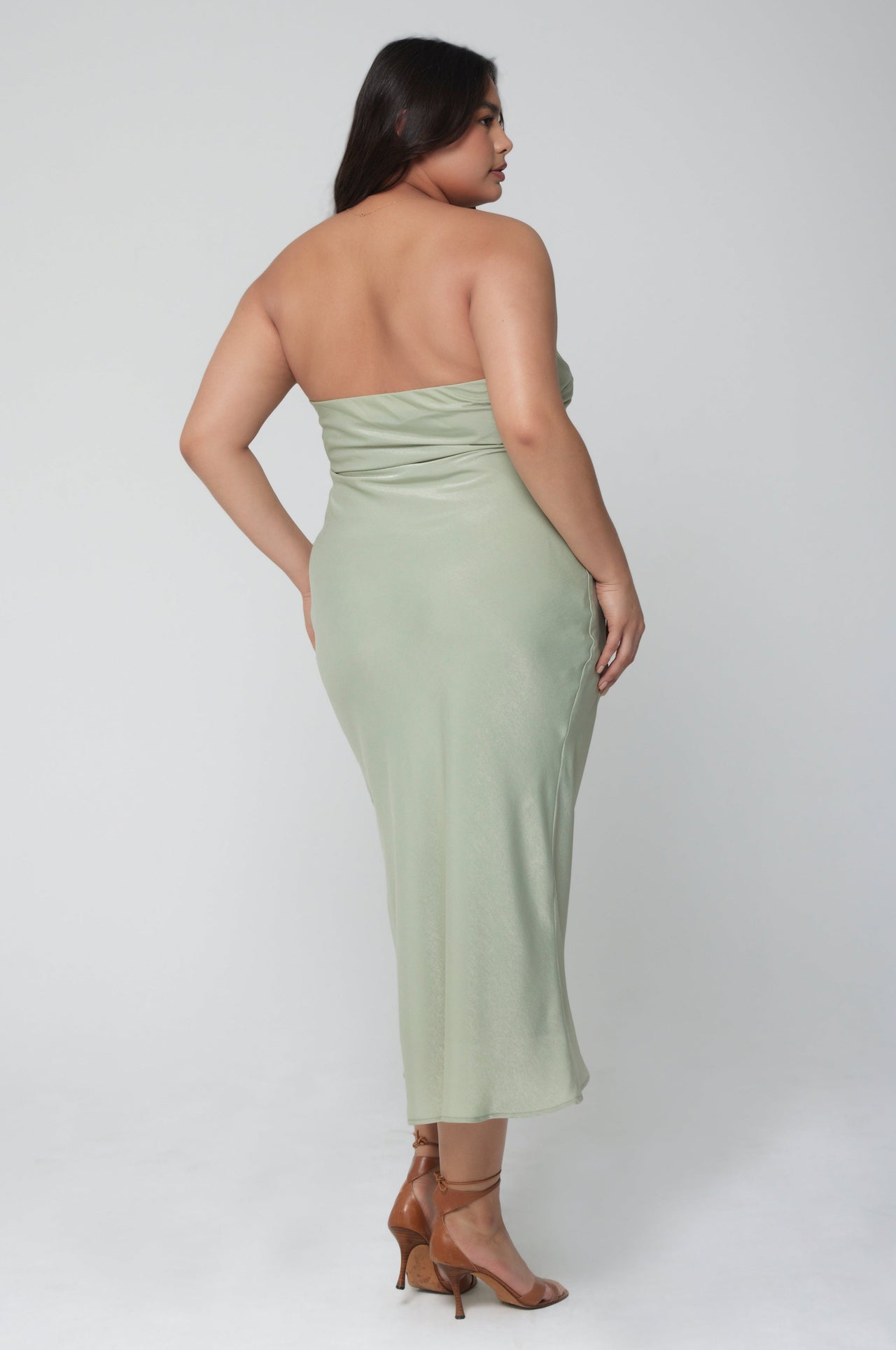 This is an image of Anna Slip in Sage - RESA featuring a model wearing the dress