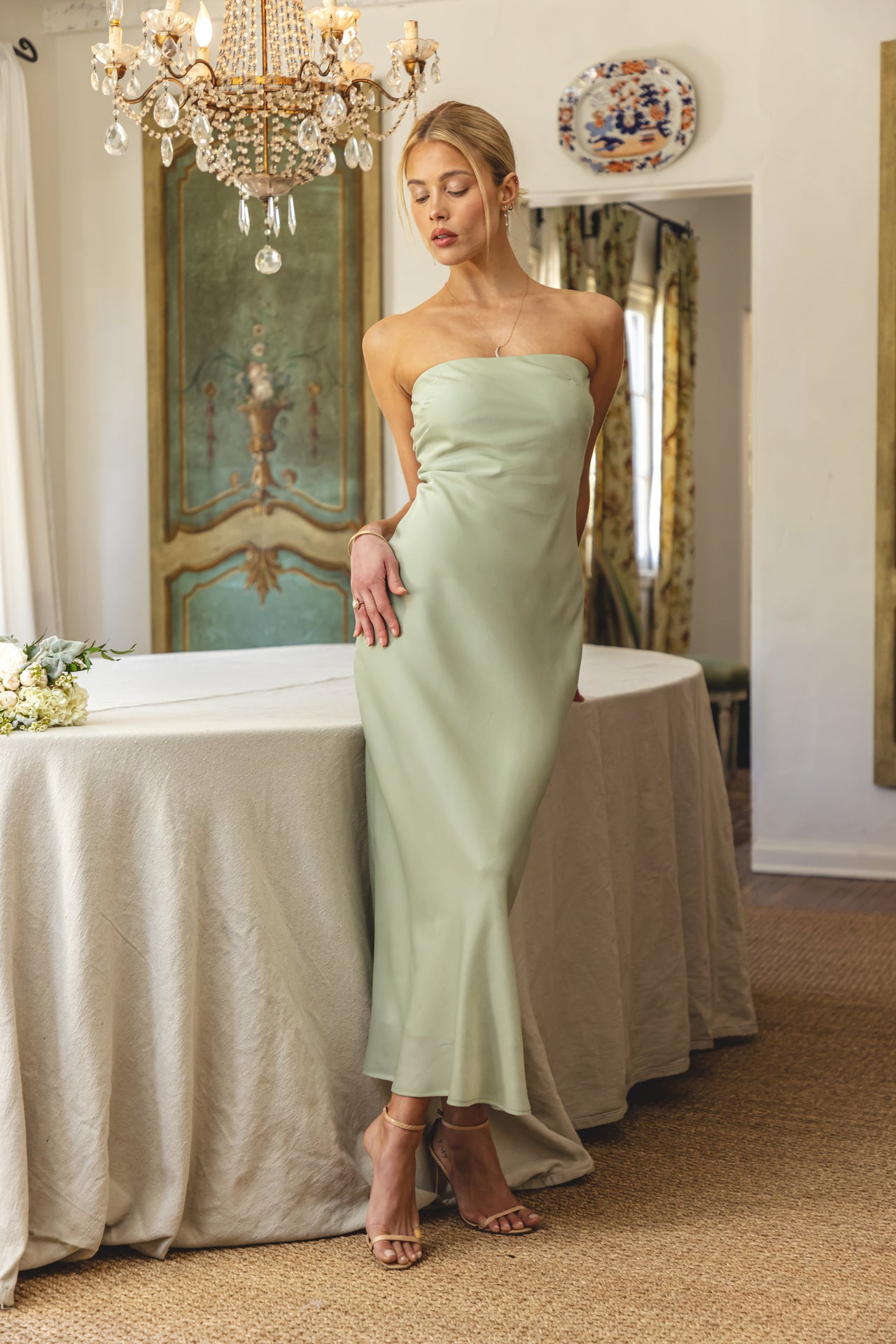 This is an image of Anna Slip in Sage - RESA featuring a model wearing the dress