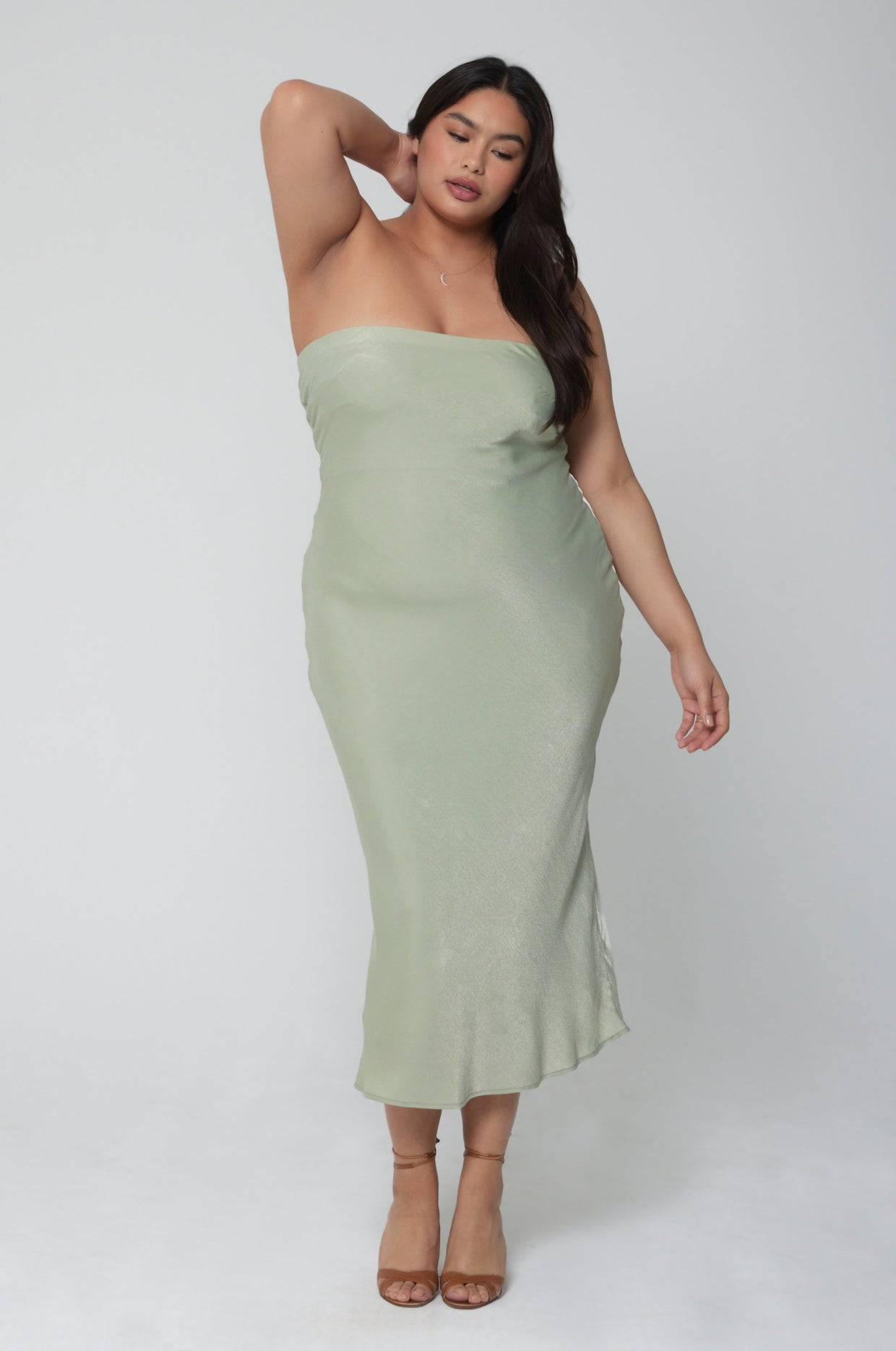 This is an image of Anna Slip in Sage - RESA featuring a model wearing the dress