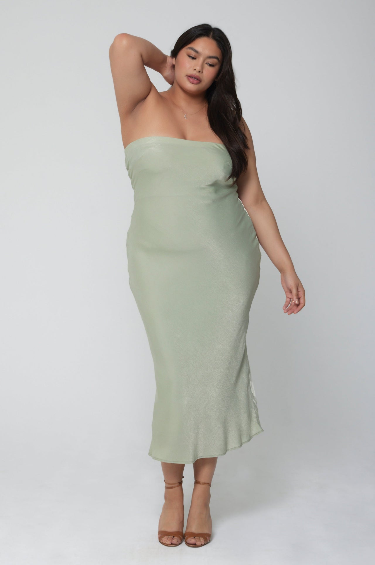 This is an image of Anna Slip in Sage - RESA featuring a model wearing the dress
