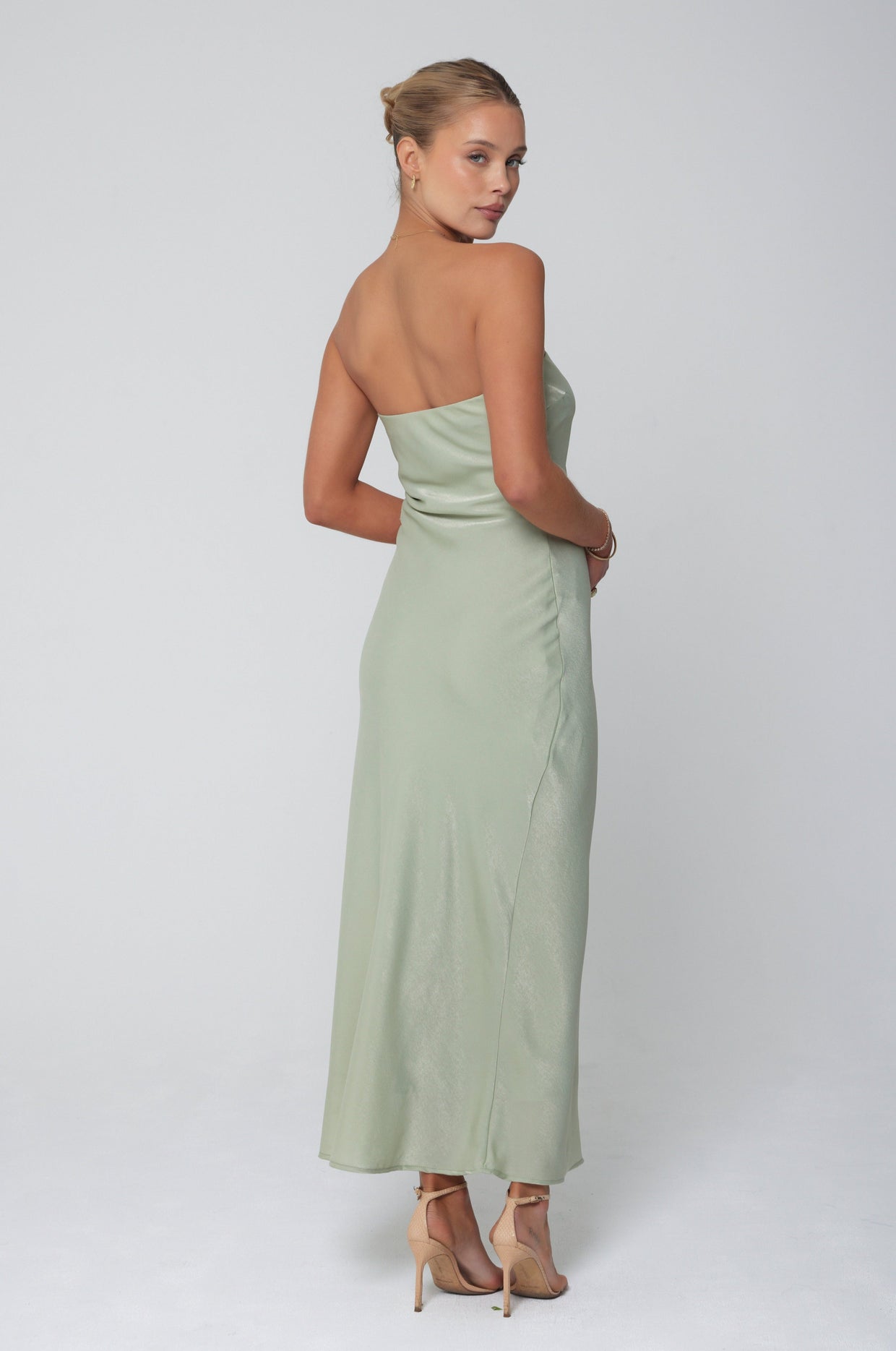 This is an image of Anna Slip in Sage - RESA featuring a model wearing the dress