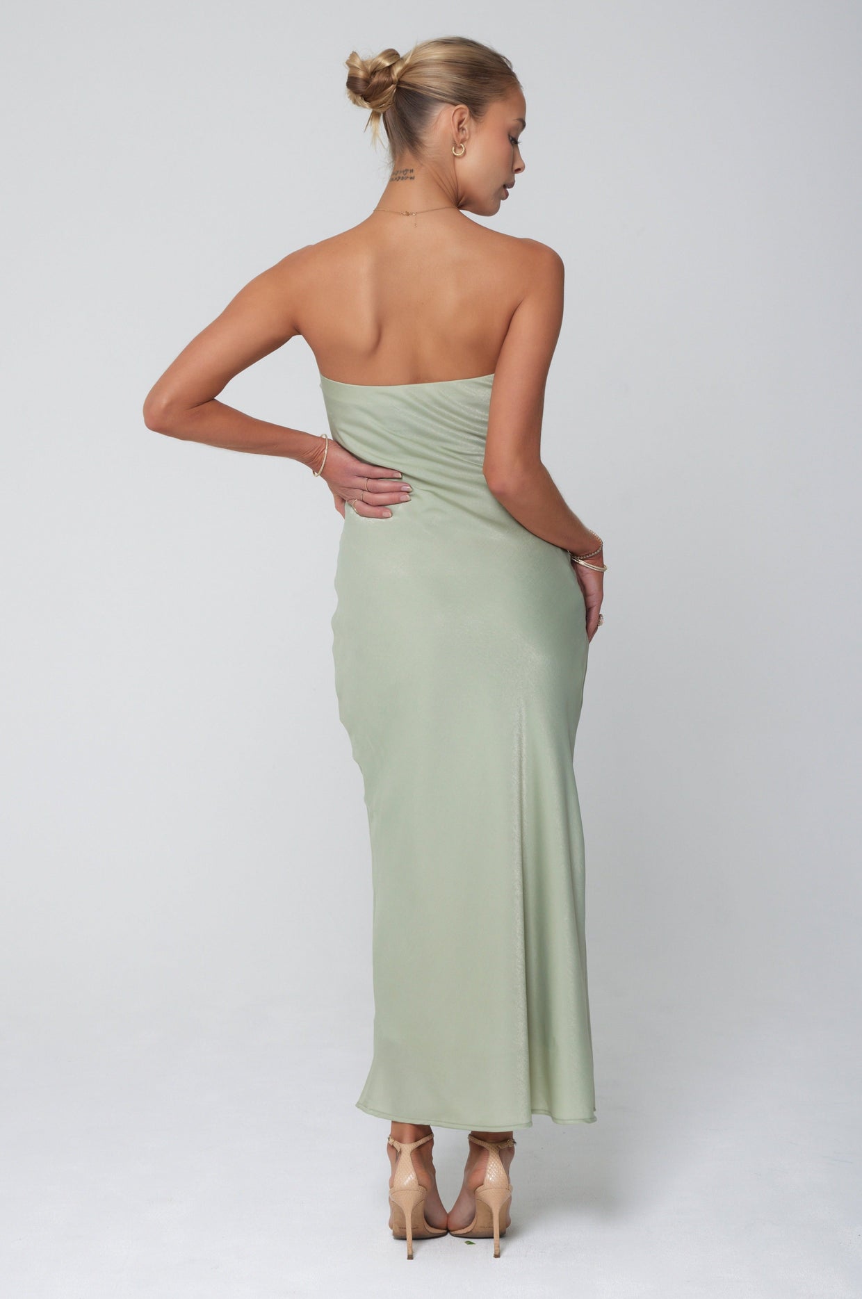 This is an image of Anna Slip in Sage - RESA featuring a model wearing the dress