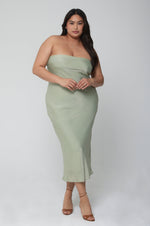 This is an image of Anna Slip in Sage - RESA featuring a model wearing the dress