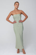 This is an image of Anna Slip in Sage - RESA featuring a model wearing the dress