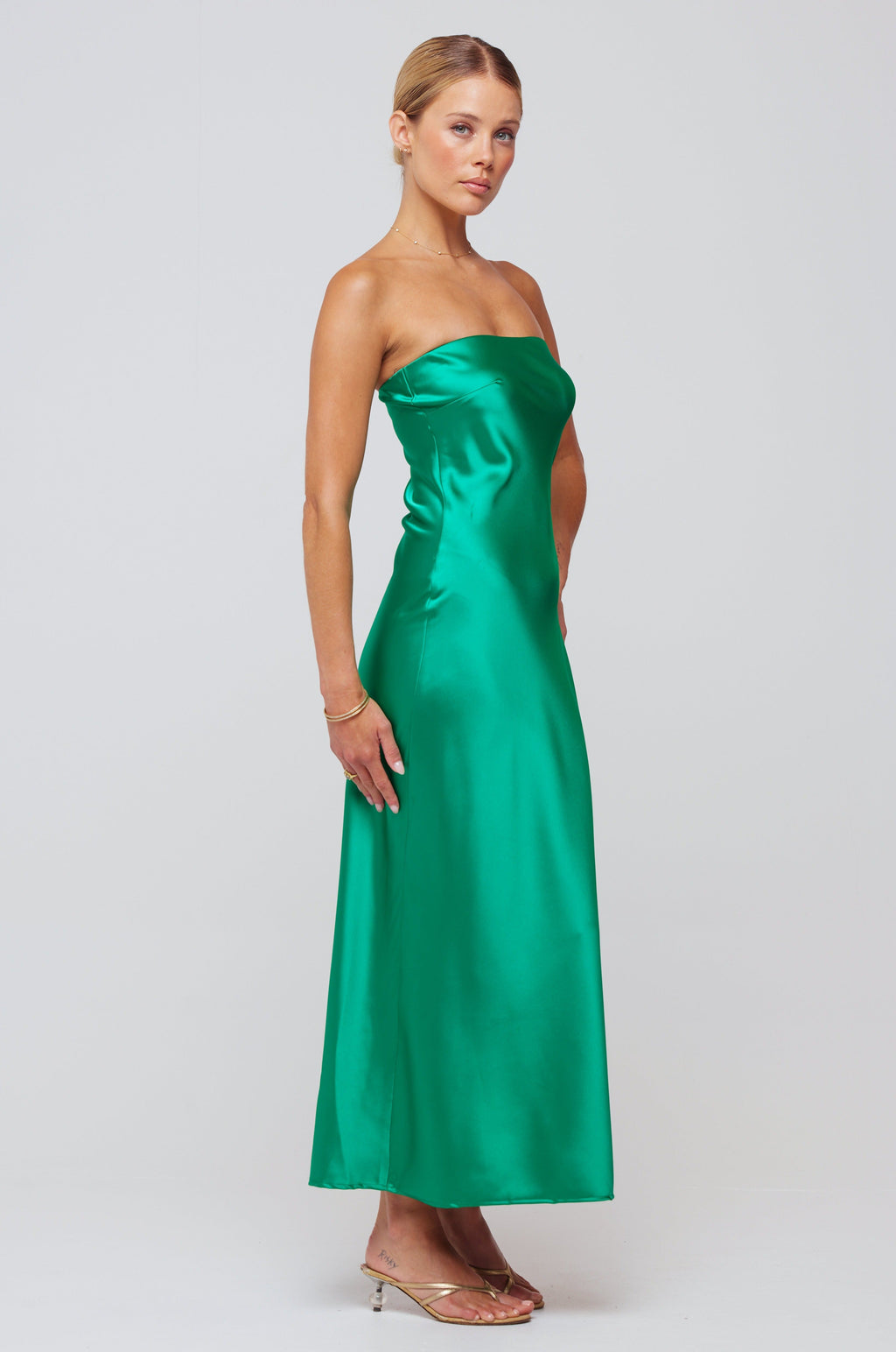 This is an image of Anna Slip in Verde - RESA featuring a model wearing the dress