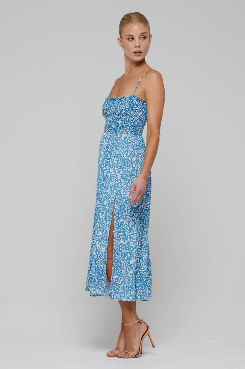 This is an image of Ashley Midi in Iris - RESA featuring a model wearing the dress