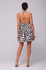 This is an image of Belle Dress in Tigris - RESA featuring a model wearing the dress