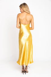 This is an image of Berri Slip in Gold - RESA featuring a model wearing the dress