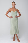 This is an image of Berri Slip in Sage - RESA featuring a model wearing the dress