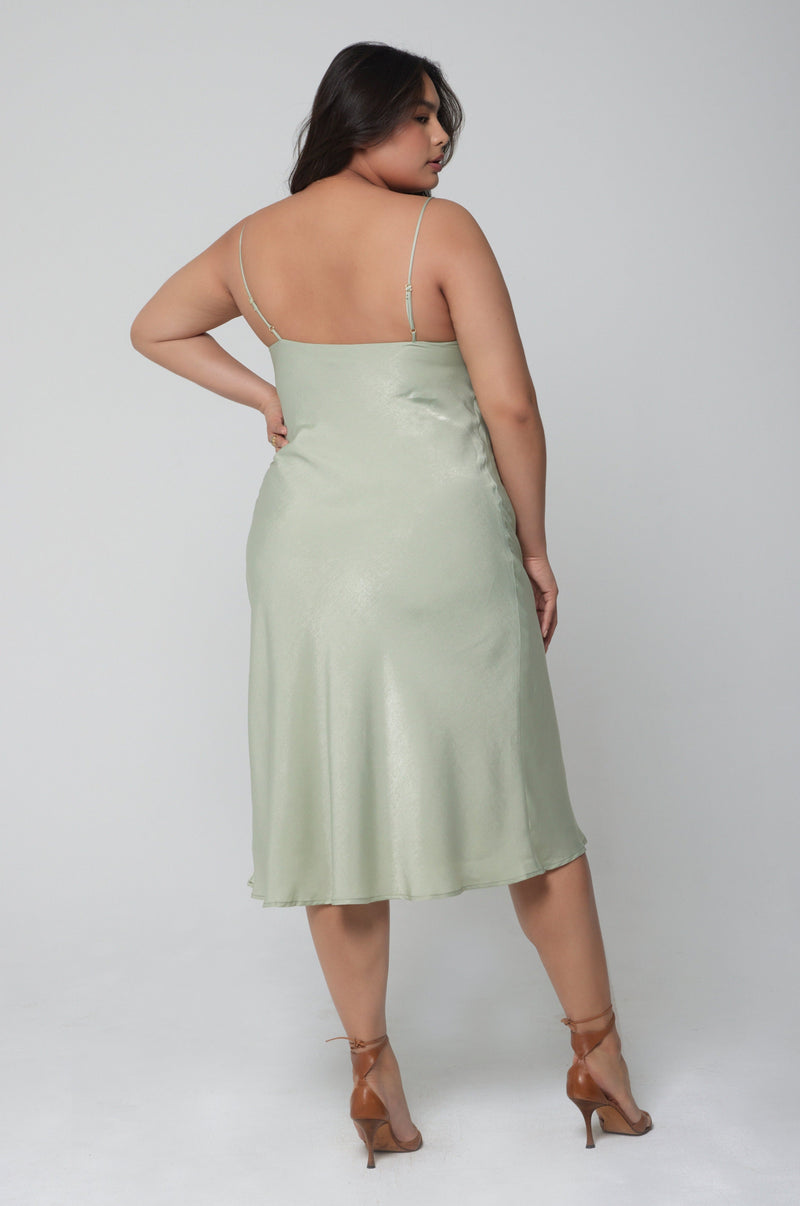 This is an image of Berri Slip in Sage - RESA featuring a model wearing the dress