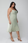 This is an image of Berri Slip in Sage - RESA featuring a model wearing the dress