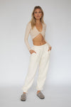 This is an image of Bodhi Sweat pants in Bone - RESA featuring a model wearing the dress