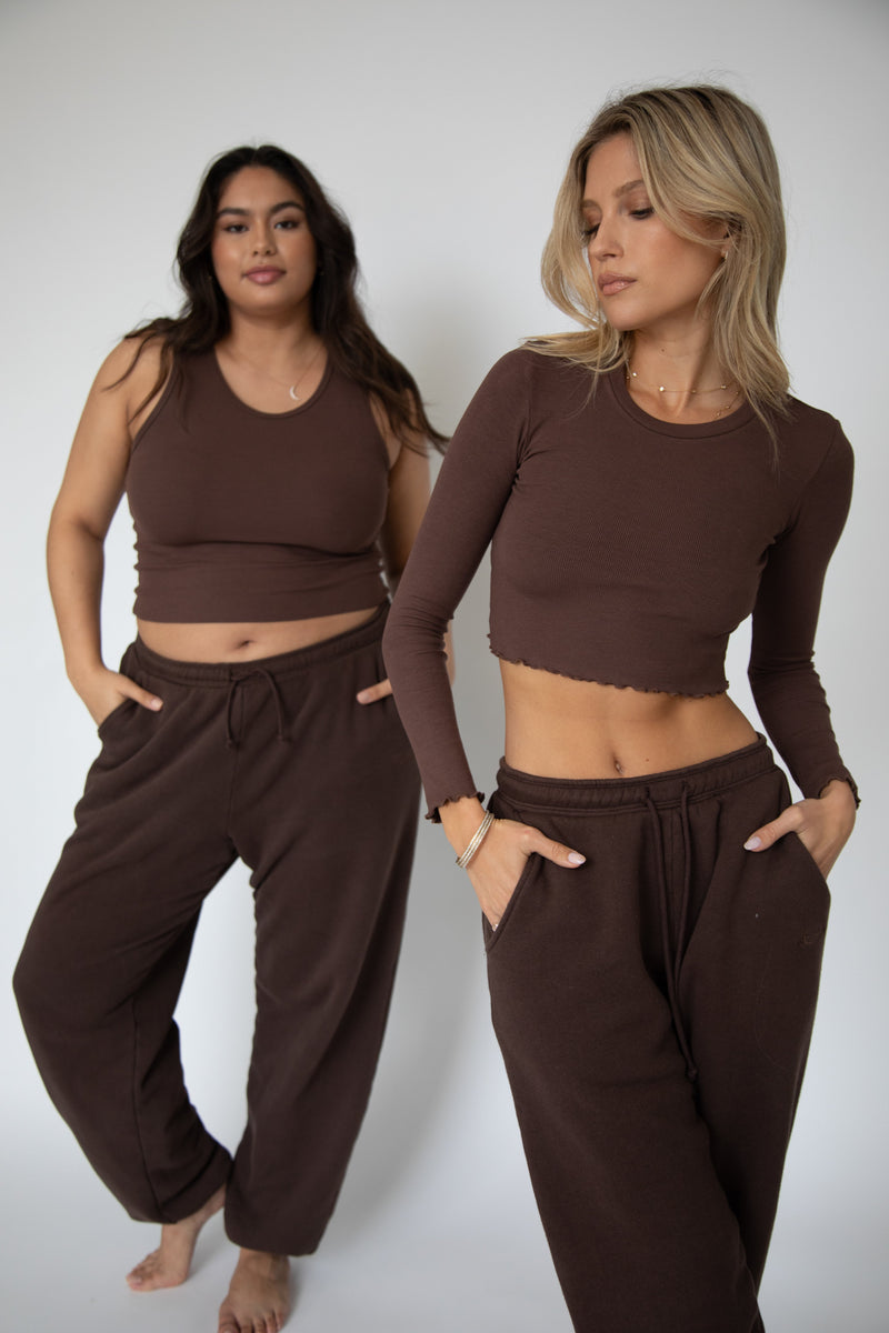 This is an image of Bodhi Sweat pants in Tobacco - RESA featuring a model wearing the dress